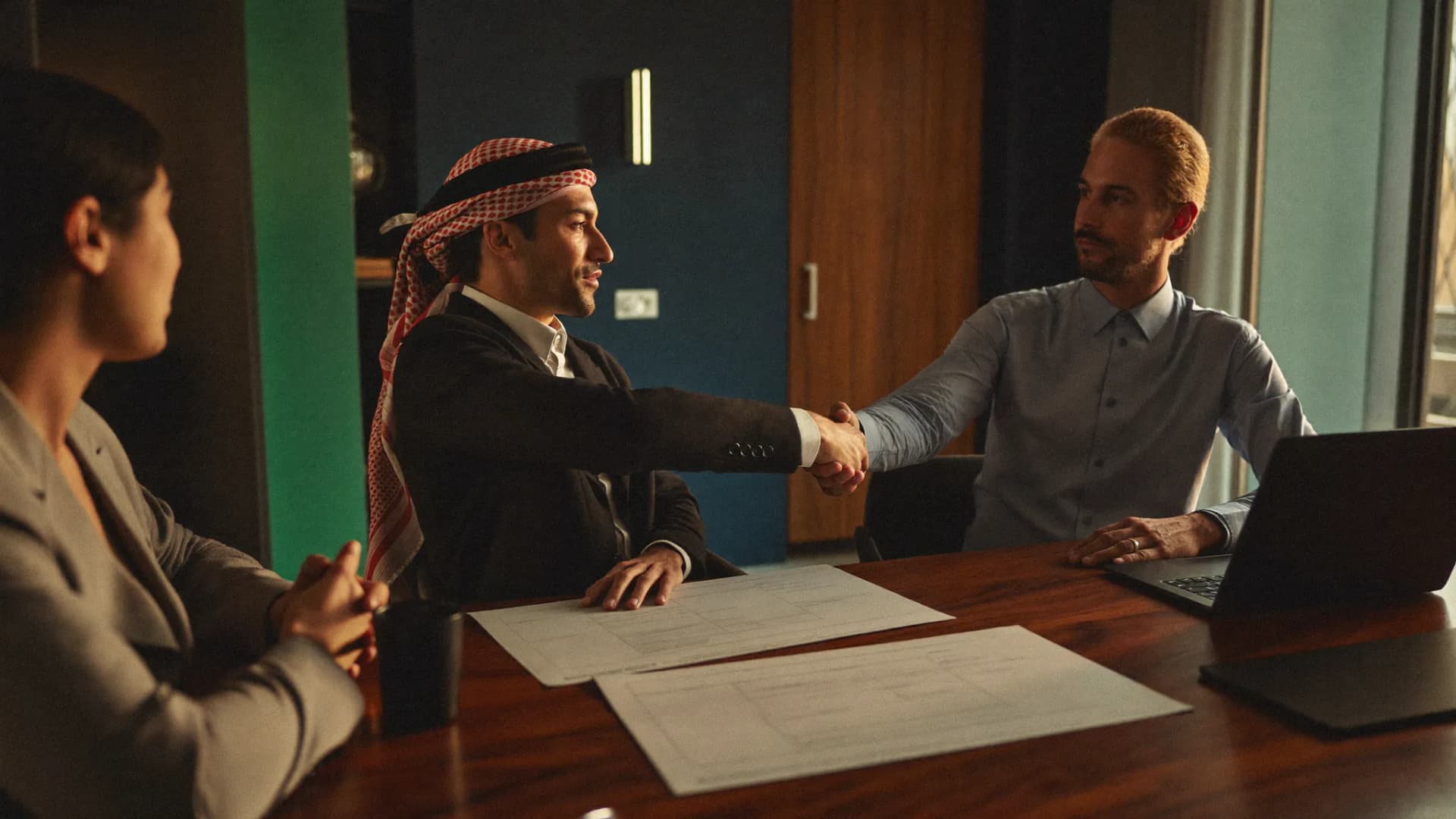 GAFZA commercial team reviews a structured pricing and placement plan in a Dubai office